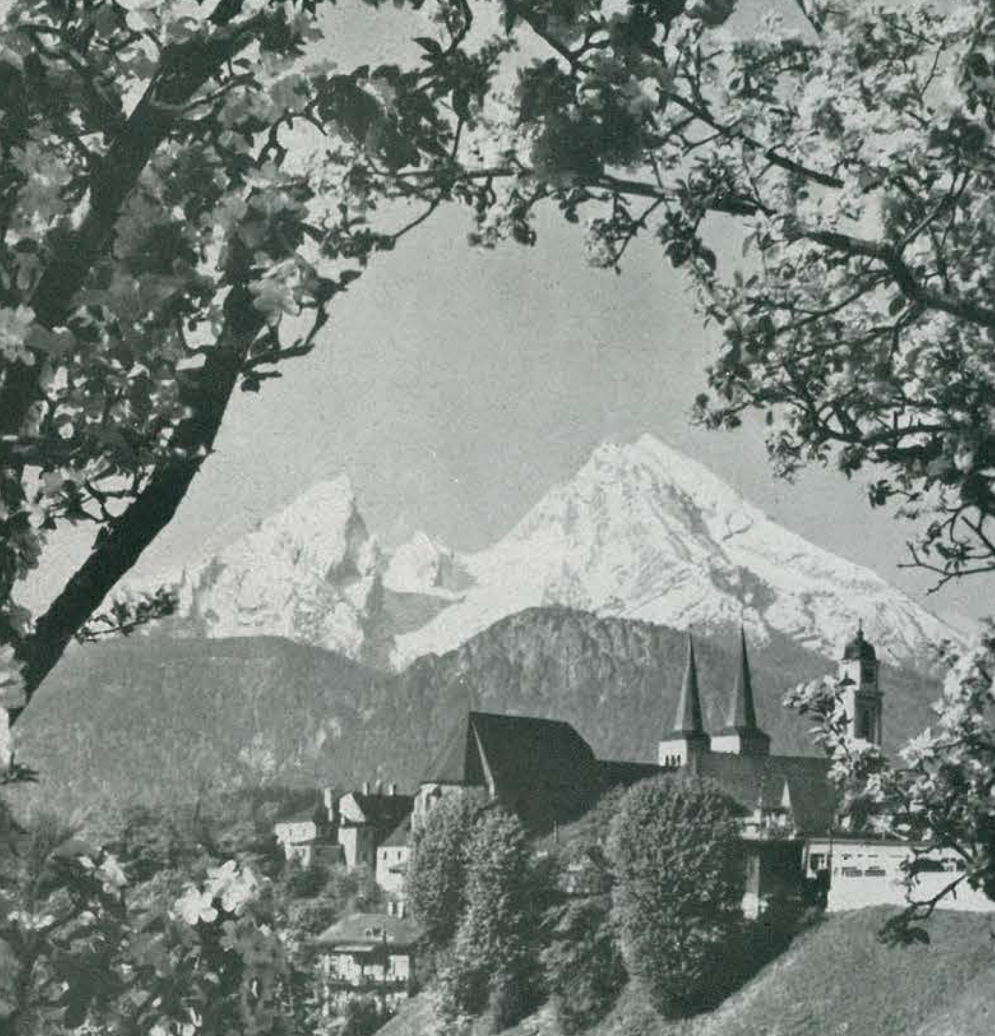 Vintage-style black and white photograph of a mountainous landscape with a building near Berchtesgaden, Germany. 